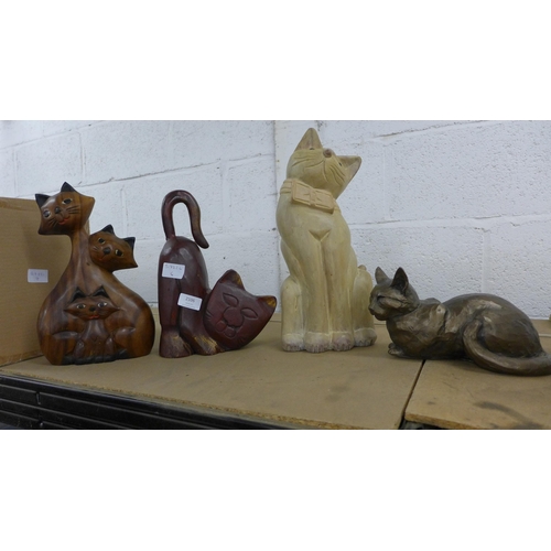 2106 - 3 carved wooden cats ornaments and one metal cat ornament