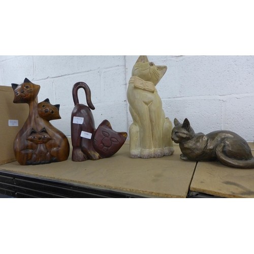 2106 - 3 carved wooden cats ornaments and one metal cat ornament