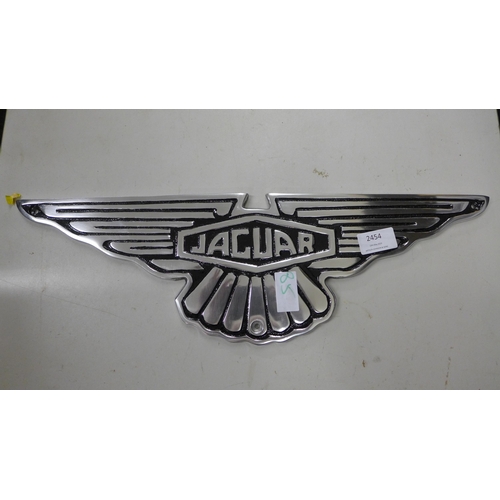 2454 - Aluminium Jaguar plaque * this lot is subject to VAT