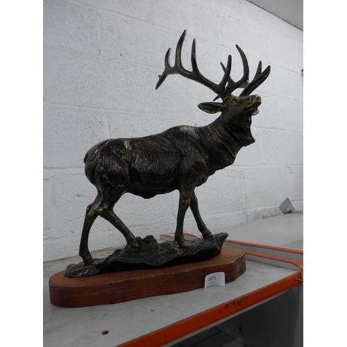 2475 - Cast stag figure with wooden base * this lot is subject to VAT