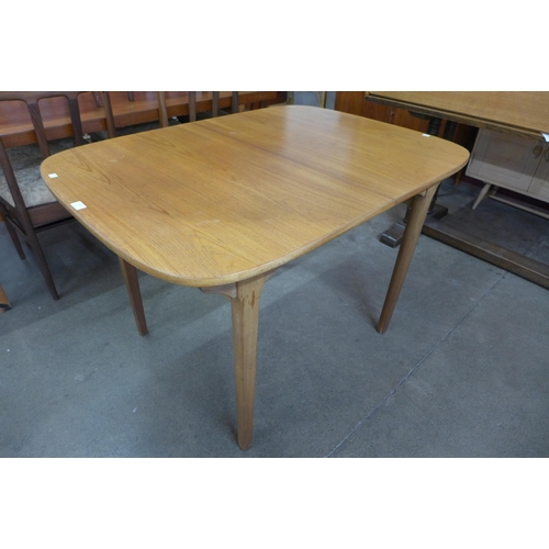 599 - A Nathan teak extending dining table