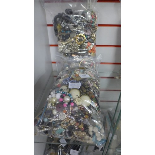 2128 - 2 bags of costume jewelry