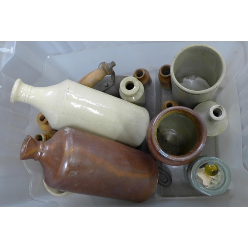 1172 - A box containing stoneware bottles, iron, glass bottle, small cast iron pan, etc. **PLEASE NOTE THIS... 