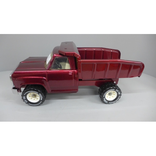 615 - A 1970's Tonka pressed steel Dodge truck, powder coated in deep cherry