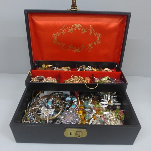 628 - A jewellery box and contents including clip-on earrings, etc.