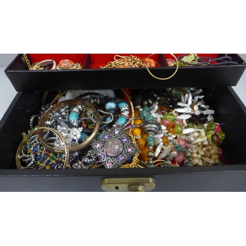 628 - A jewellery box and contents including clip-on earrings, etc.