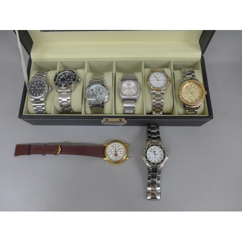 635 - Eight wristwatches in a display box