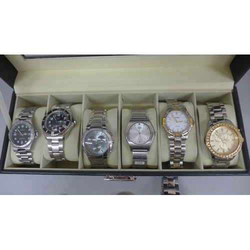 635 - Eight wristwatches in a display box