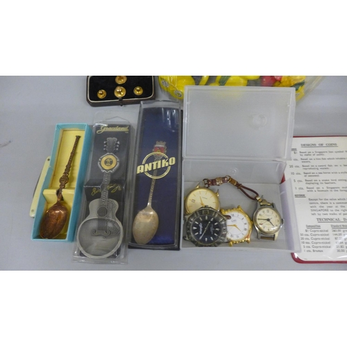 642 - Wristwatches, pin badges, an Elvis Presley souvenir spoon, etc.