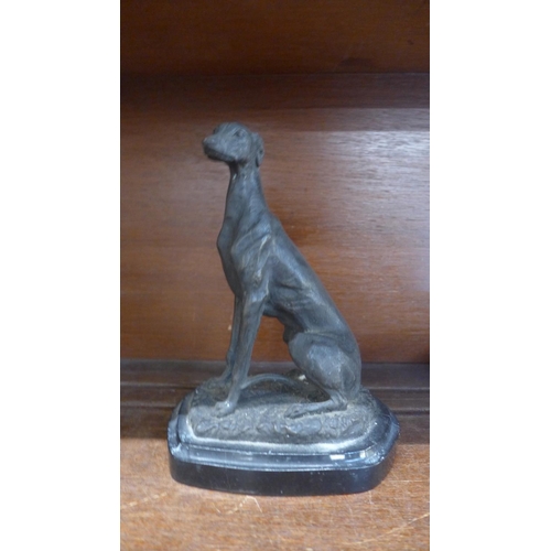 643 - A model of a lurcher on a marble plinth, 19cm