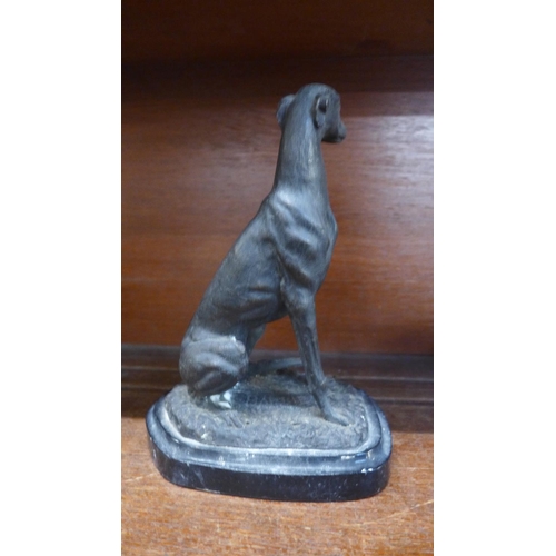 643 - A model of a lurcher on a marble plinth, 19cm