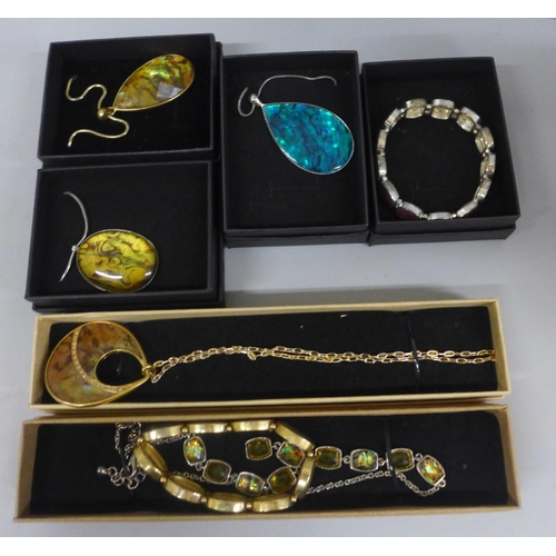 645 - Seven pieces of abolone style jewellery, boxed