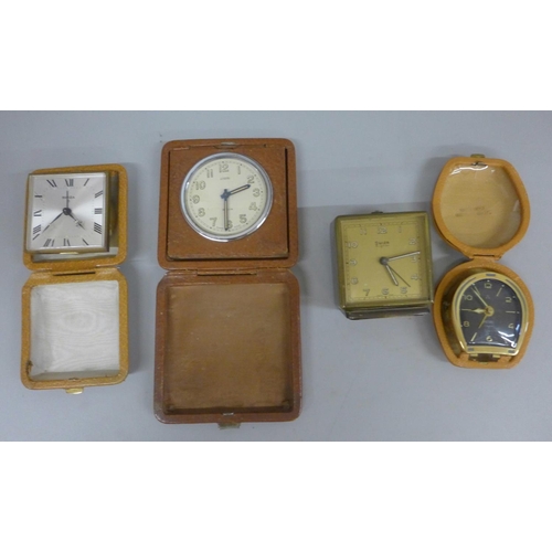 659 - Four small clocks including two Swiza and an 8 Days travel clock