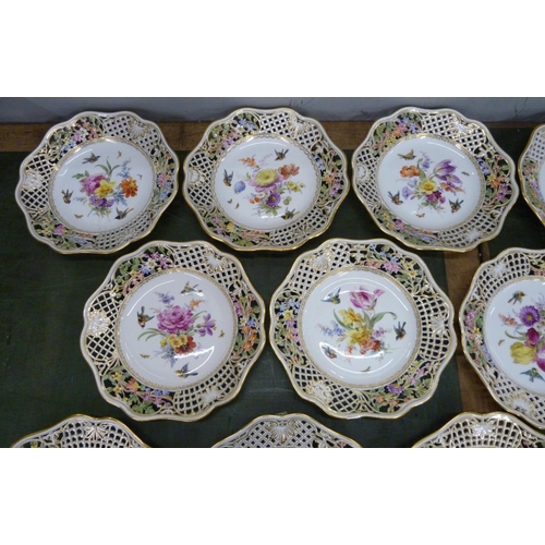 701 - A 19th Century Meissen fourteen piece part dinner service, each piece decorated with birds, insects ... 