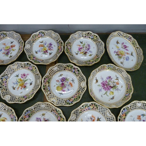 701 - A 19th Century Meissen fourteen piece part dinner service, each piece decorated with birds, insects ... 