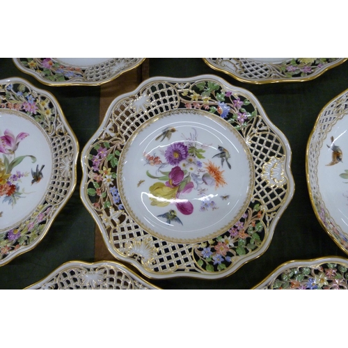 701 - A 19th Century Meissen fourteen piece part dinner service, each piece decorated with birds, insects ... 