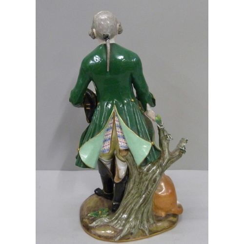 705 - A Meissen figure of a Georgian gentleman and gun dog, a/f, 29.5cm