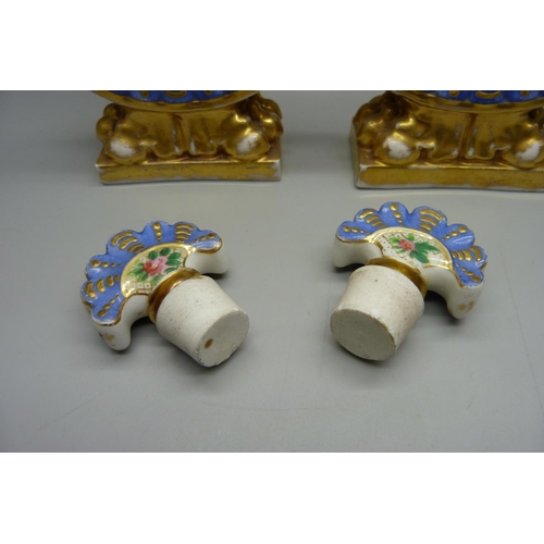 708 - A pair of 19th Century continental porcelain flasks, decorated with flowers against a gilt and blue ... 