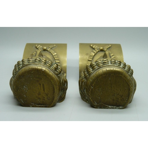 709 - A pair of gilt brass ormolu neo-classical head brackets