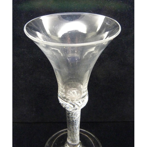 726 - An 18th Century air twist goblet, circa 1740, the air twist extending into the solid base of the tru... 