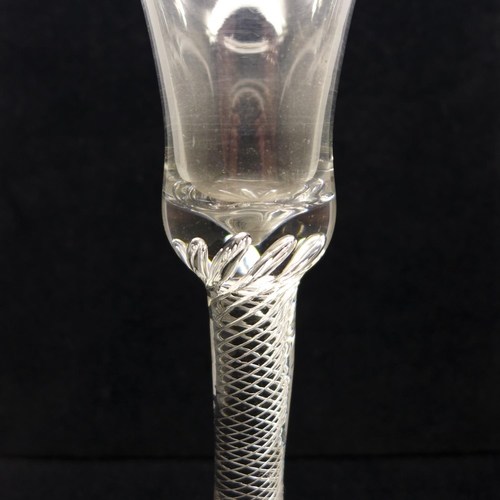 726 - An 18th Century air twist goblet, circa 1740, the air twist extending into the solid base of the tru... 