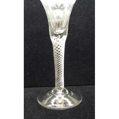 733 - An 18th Century wine glass having a bell bowl with an engraved frieze of vines and grapes over an ai... 