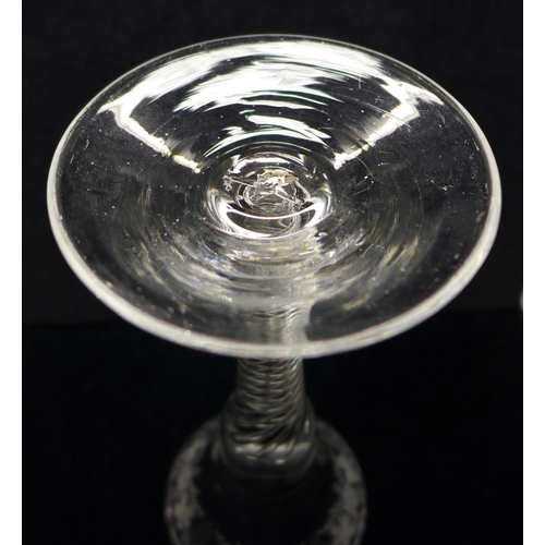 733 - An 18th Century wine glass having a bell bowl with an engraved frieze of vines and grapes over an ai... 