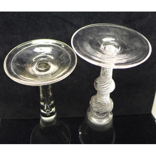 738 - An 18th Century wine glass having a bucket bowl with solid base over a double air twist knopped stem... 