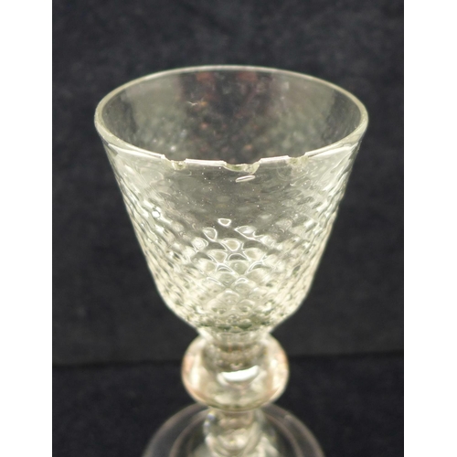 740 - An 18th Century wine glass, circa 1720, with hammered conical bowl over a teared baluster knop stem ... 