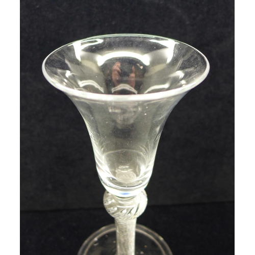 743 - An 18th Century wine glass, circa 1750, having a bell bowl with solid base over a shoulder knop air ... 