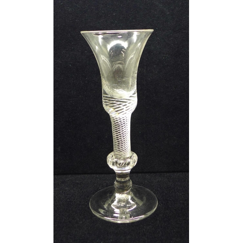 744 - An 18th Century composite wine glass having a bell bowl with solid base over an air twist stem with ... 