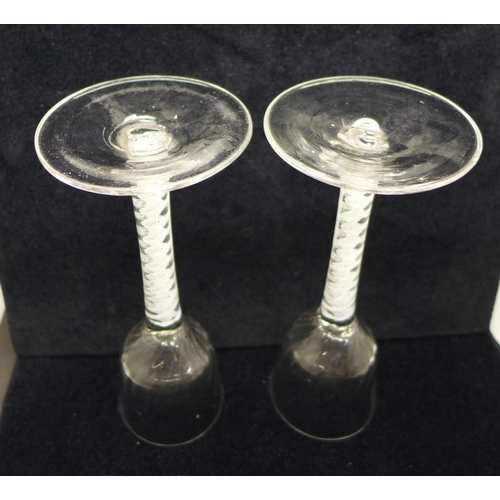 745 - A pair of 18th Century wine glasses, each with moulded ogee bowl over a double series open twist ste... 