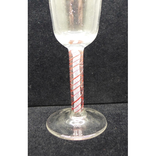 747 - An 18th Century colour twist wine glass, circa 1770, with a round funnel bowl over the stem containi... 