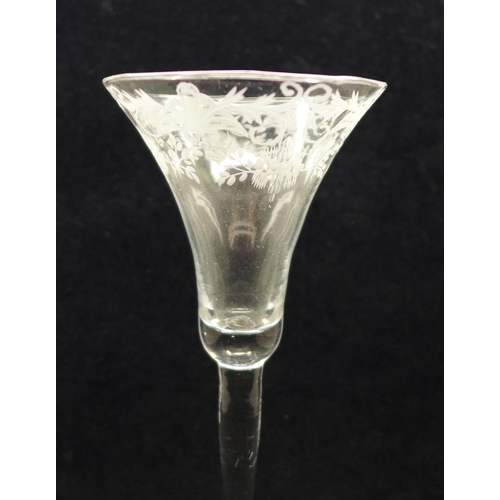 749 - A wine glass, circa 1730, engraved floral trumpet bowl over plain stem and wide conical foot, 17.5cm