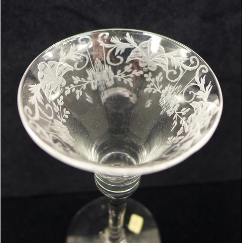 749 - A wine glass, circa 1730, engraved floral trumpet bowl over plain stem and wide conical foot, 17.5cm