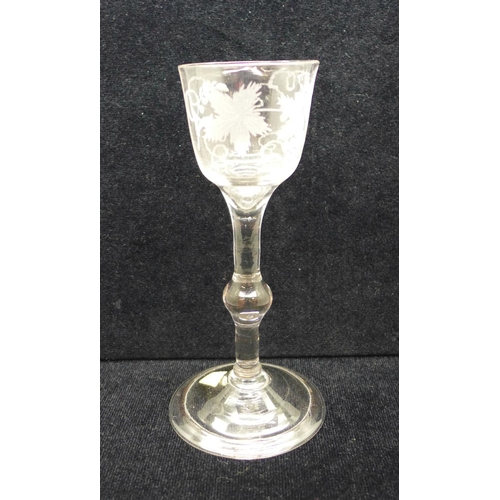 750 - A wine glass, circa 1740, balustroid with ogee bowl with central knop over folded foot, 14.5cm