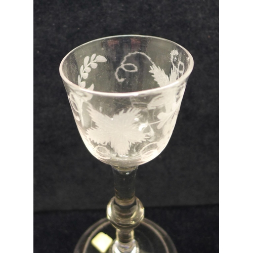 750 - A wine glass, circa 1740, balustroid with ogee bowl with central knop over folded foot, 14.5cm