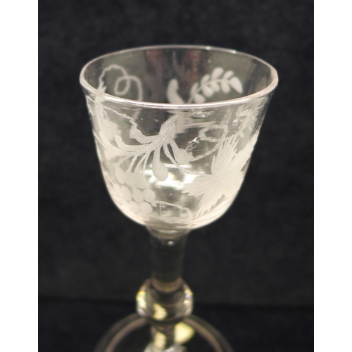 750 - A wine glass, circa 1740, balustroid with ogee bowl with central knop over folded foot, 14.5cm