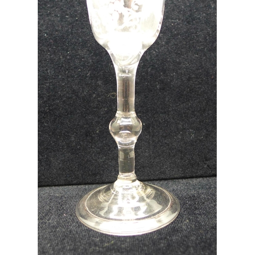 750 - A wine glass, circa 1740, balustroid with ogee bowl with central knop over folded foot, 14.5cm