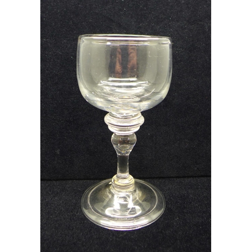 751 - A wine glass, circa 1720, cup bowl with solid base over triple knop over an annvalated knop on folde... 