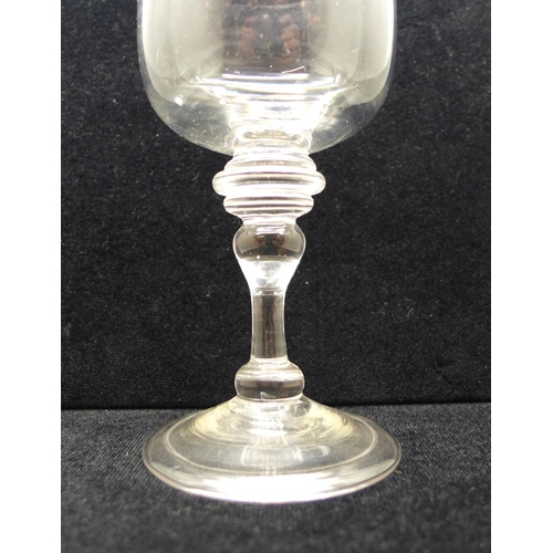 751 - A wine glass, circa 1720, cup bowl with solid base over triple knop over an annvalated knop on folde... 