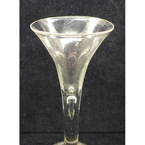 755 - A wine glass, circa 1750, trumpet bowl over tiered stem over folded foot, 17.5cm with wine glass, ci... 