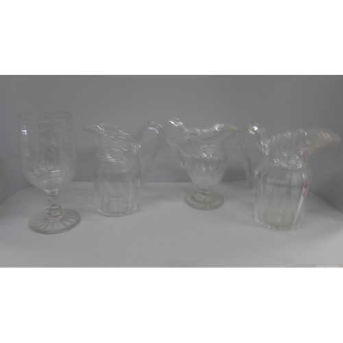 768 - Three 19th century glass jugs and a celery vase