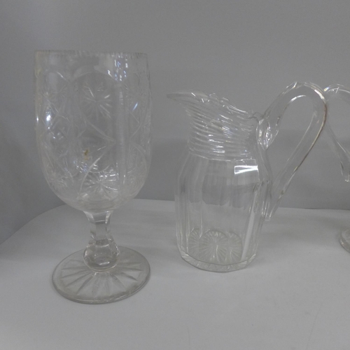 768 - Three 19th century glass jugs and a celery vase