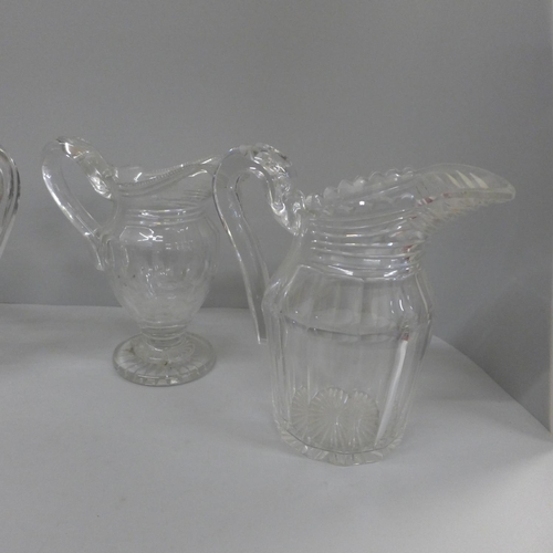 768 - Three 19th century glass jugs and a celery vase