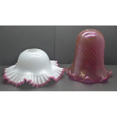 779 - A quilted cranberry glass shade and white glass shade with applied cranberry frill