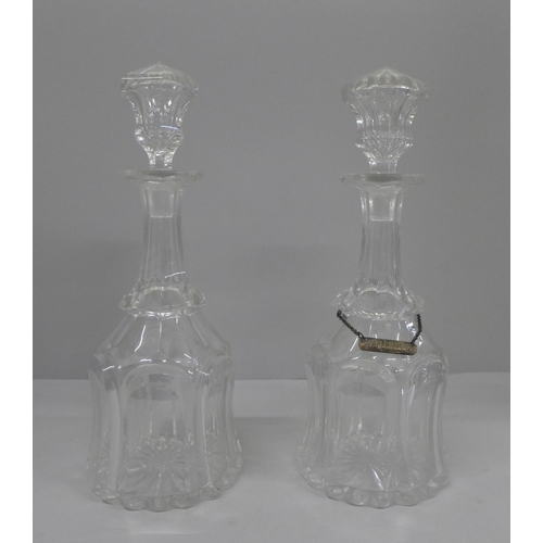 790 - A pair of 19th Century bell shaped crystal decanters, one with silver whisky label