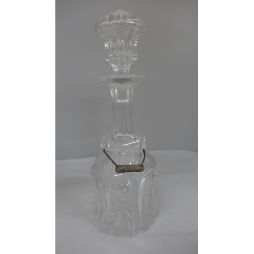 790 - A pair of 19th Century bell shaped crystal decanters, one with silver whisky label