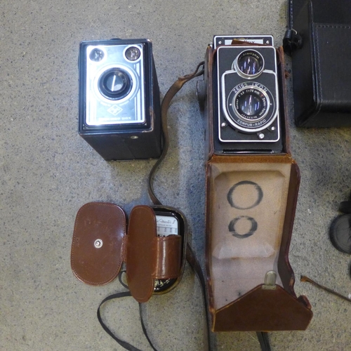 810 - A pair of Tasco 6x18x35 binoculars, a Zeiss Ikon Ikoflex camera, a Weston Master II light meter, an ... 