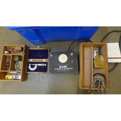 814 - Watchmaker's tools:- an electronic demagnitiser, bushing tool, boxed, digital calipers, vice, two ja... 